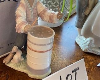 Lot 5596. $125.00. Lladro #06277 "Caribbean Rhythm" made exclusively for "Little Switzerland" 8" tall, x 4" deep. Young Man Banging on Drums!