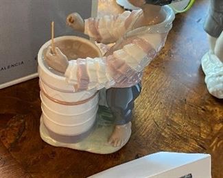 Lot 5596. $125.00. Lladro #06277 "Caribbean Rhythm" made exclusively for "Little Switzerland" 8" tall, x 4" deep. Young Man Banging on Drums!