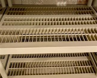 Lot 5664 $24.00 Ea. 3 Plastic 5 Shelf Units (Buy all 3 for $70.00). The stuff on them is not included in this lot.