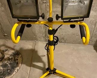 Lot 5670 $20.00 Tripod with Dual Halogen Work Lights. One of the lights needs a Halogen Bulb. The Pole extends to bring light almost anywhere.