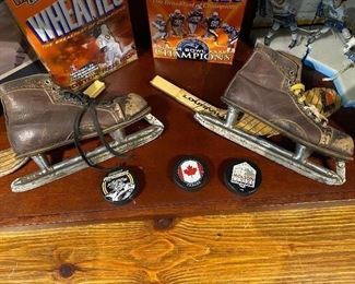 Old Hockey Skates and Pucks