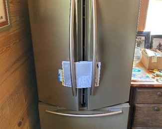 Refrigerator ( runs but freezes over after two weeks )