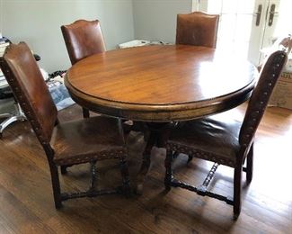 Wood dining table and leather chairs (sold separately)