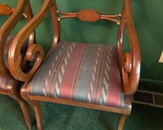two armchairs sold with dining table