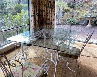 Dining table wrought iron and glass with two armchairs and two side chairs Table is 48"w x 60" l x 29"h.  $320