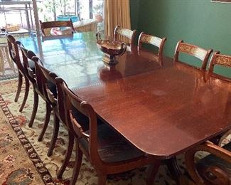 Three pedestal dining table 94.5"l x 43.75"w x 27.5"h can be shortened by removing the center section which is 31 10/16th wide.  Carpet is not for sale. $990 for table and 10 chairs