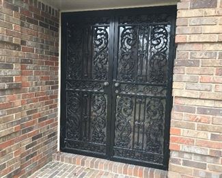 Double cast iron security/storm door with lock and working key