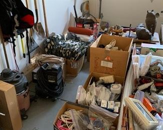 Assorted garage finds including small compressor, shop vac, hand grinder etc