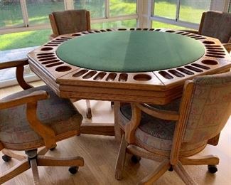 Game table w/ 4 rolling chairs (height adjustable).