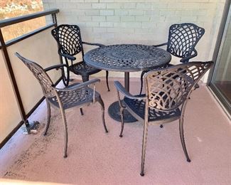 $350 - Cast Aluminum Outdoor Lifestyle table and four chairs.  Table: 29.5"H x 36"D; chairs: 37.5"H x 25"W x 20"D (seat height 18"H) Includes umbrella opening!