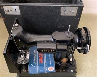 $250  - Vintage Singer sewing machine with case.