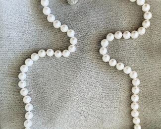 $850 - Tiffany Iridesse pearl necklace; 22” length,  7.5mm-8mm pearls with 18K open circle diamond clasp (.20 tw); stamped IRIDESSE 18K 750.  Includes cloth case and original box