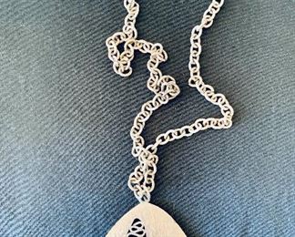 $20 - Vintage “Mod” silvertone necklace with triangular pendant; 30” chain, 3” pendant