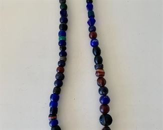 $28 - Glass bead asymmetrical necklace; 26” 