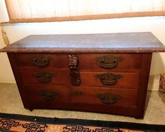 Marble topped  antique dresser with hidden drawer.  