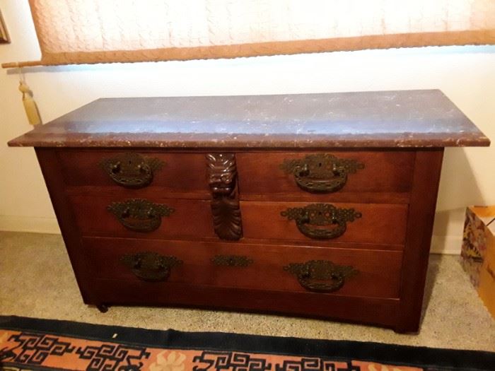 Marble topped  antique dresser with hidden drawer.  