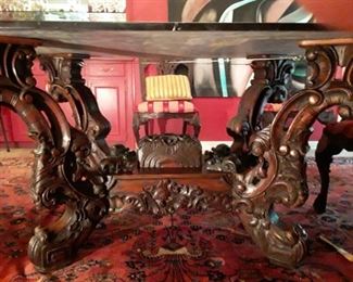 Carved intricate wooden Dining table with Black marble top.  $ 1200.00  OBO