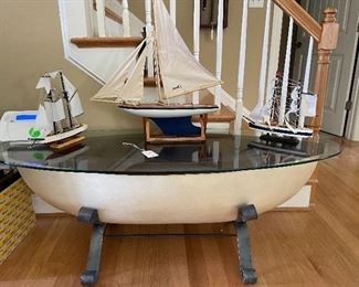 Unique glass top boat coffee table