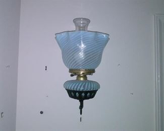Electrified blue swirl glass wall lamp.