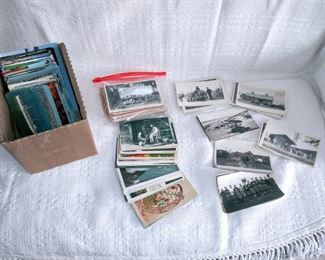 Over 200 postcards, many real photo and pre 1940's view cards.