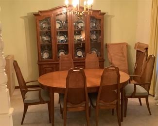 Drexel Heritage Repertoire dining table with 2 leaves, 2 captain and 4 armless chairs.  Matching China cabinet