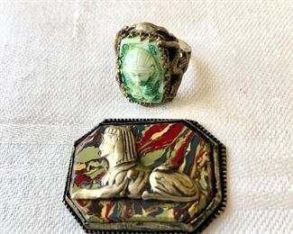 $20 each. Egyptian revival ring and plaque with sphinx.  Pin: 1.5"L; 1"W.  Ring size: 5 Ring SOLD 