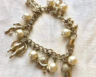 $12 Pearl and gold tone charm bracelet.  7.5"L