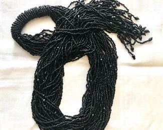$60 Extra extra long multi strand black beaded overlap necklace 