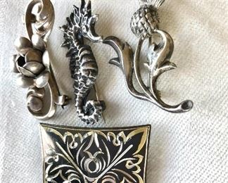 $15 each sterling silver pins, flower pins marked Beau sterling. Top: 1.5"L; 0.5"W.  Middle:  1.5"L.  Bottom: 1.2"x 1.2"Thistle and seahorse SOLD 