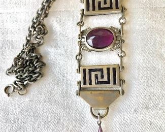 $40 Long Art Deco style pendant with purple stones.  Pendant: 5"L.  Chain: 16"L