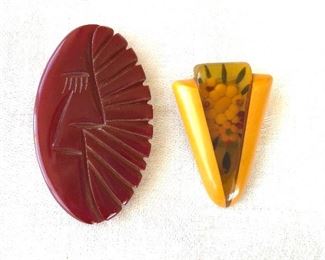 $35  each Art deco fur clips - Left  2 and 1/4 inches Long and 1.5" Wide.      Right translucent apple juice bakelite with floral design .   Red: 2.5"L .  Yellow: 2"L