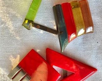 $30 LOT  Bakelite or lucite belt buckles top one AS IS.   Red: 4.5"L.  Multicolor: 5.5" extended
