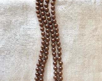 $28   Extra long faux pearl  necklace with gold tone clasp 