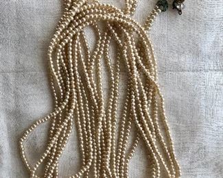 $40 Extra extra long mini faux  pearl vintage necklace with some discoloration at the clasp.  60"L