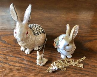 $25 each - Kingspoint Designs enamel and rhinestone bunny hinged trinket boxes with  with matching necklaces - Back left: 3.75" H, 3" L. Back right: 3" H, 2.5" L. Front left: Bunny 1" H on 16" chain.  Front right: Bunny .75" H on 20" chain.