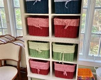 $195 - Shelving  cubby -  three separable pieces. Top and center: each 24.5" H, 29" W, 13" D; lower: 15.5" H, 29" W, 20.75" D.  20 gingham-lined baskets available (each 9" H, 12"W, 12" D): 8 red, 8 blue, 4 green. 