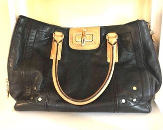 $75 Milly Black purse gold accents   10" H, 15" W, 4" D, 7" handle drop.
