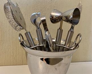 $40  Metal container with various bar utensils.  Container 5.25" H, 6.5" diam.