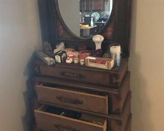 One-of-a-kind dresser, looks like stack of suitcases. Candles and mirror separate.