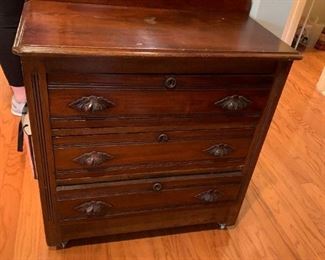 #25	Antique 3 drawer End Table on Wheels (as is top) 28Wx14Dx29T	 $75.00 
