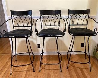 3 metal swivel barstools.