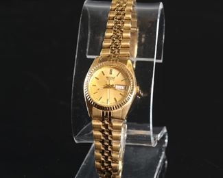 Women’s  Seiko Quartz Day/Date 7N83-0041  Watch Gold Tone Band	25mm wide with crown	
