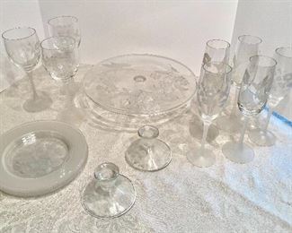 #49- $50 Frosted crystal dessert set (4 plates + 5 champagne + 3 wine glasses + 2 candlesticks + cake stand with floral and birds etched 		 