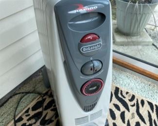 #112 Delonghi electric and oil heater $95