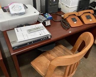 Vintage wooden desk chair, printer, DVD player, leather covered telephones.