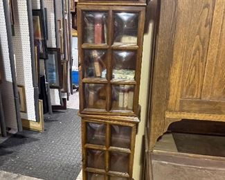 This is an amazing MCM cabinet with convex glass panels. There is a light bulb too that lights up this beautiful display cabinet. Measurements are approx. 24" wide X 6' tall.