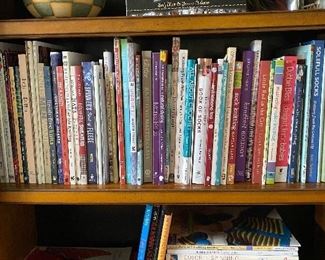 lots of knitting books, patterns, supplies, and yarn