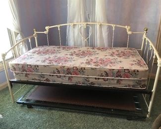 Painted white metal trundle bed with one mattress