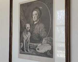 One of several framed engravings