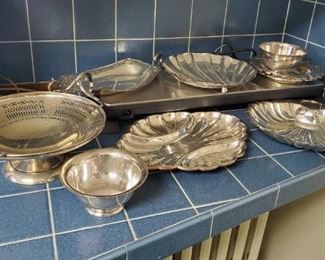 Silver plated serving pieces. Many more not shown